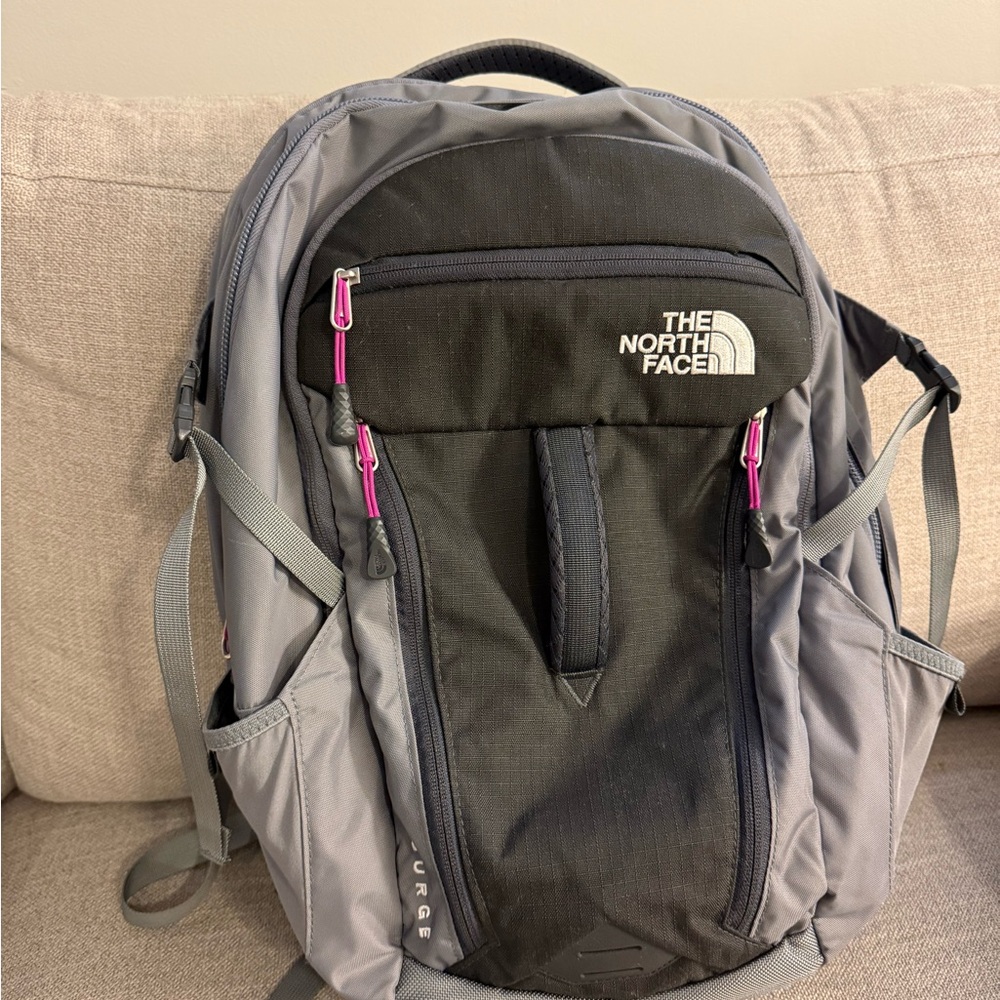 The North Face Surge Black and Gray Backpack with Pink Zippers